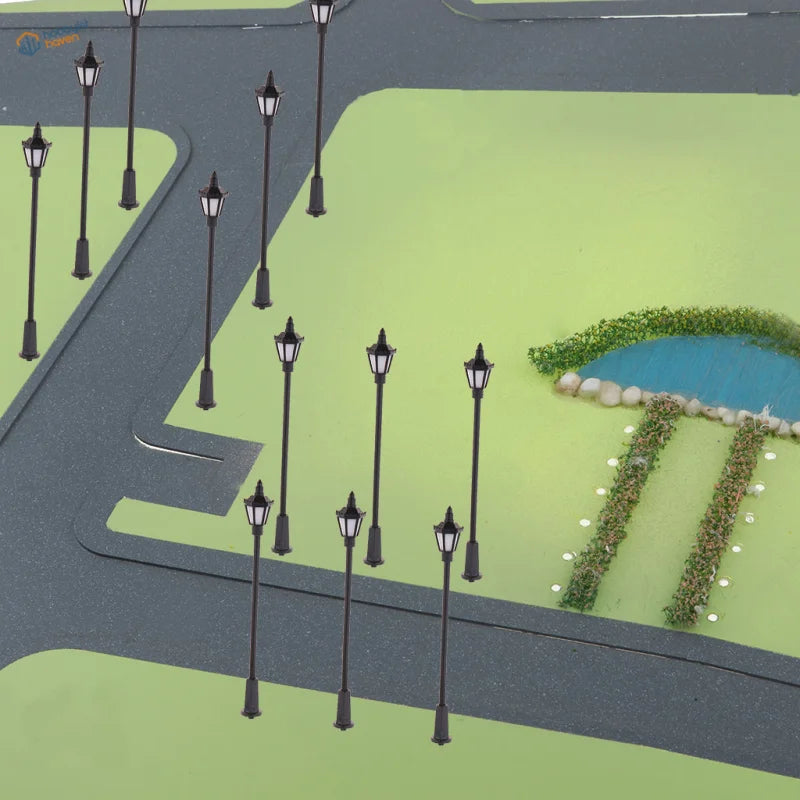 HO scale LED streetlights with black lantern tops on model town street