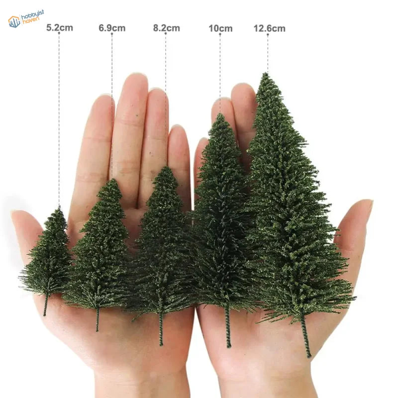 Five HO scale model trees with textured dark green surface and slender stem