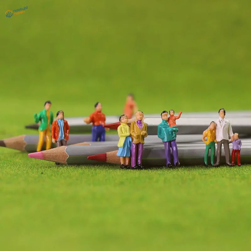 HO scale people figures set: 100 colorful painted miniatures on grass