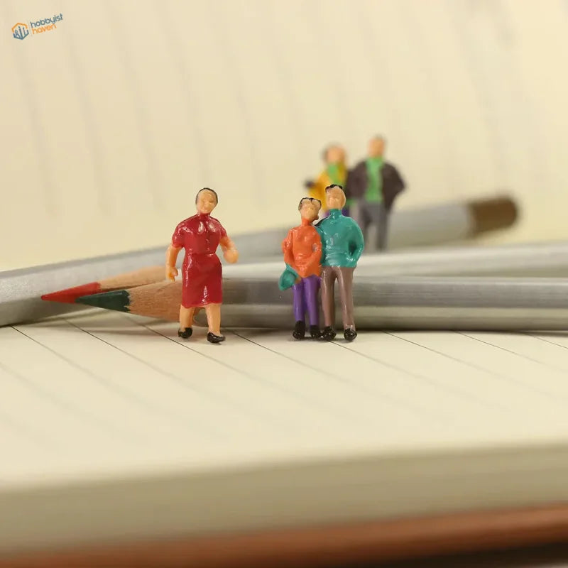 HO scale people figures set: 100 painted miniatures on lined paper with pencils