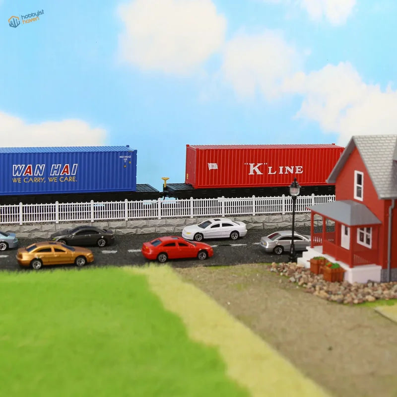 HO scale train model with blue and red Wan Hai K Line containers