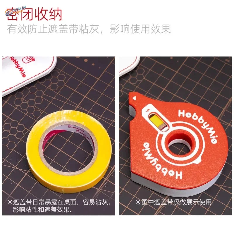 Orange plastic hobby mio masking tape cutter with white branding and yellow window to prevent tangled roll slows
