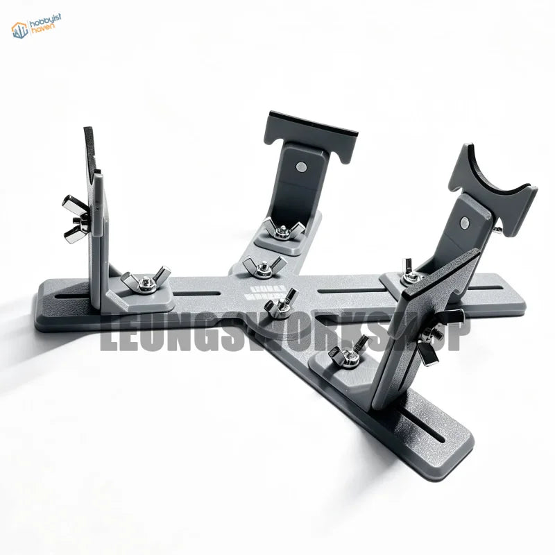 Gray metal tripod-style camera mount with adjustable clamps and wing nuts for model building tools by leungs workshop