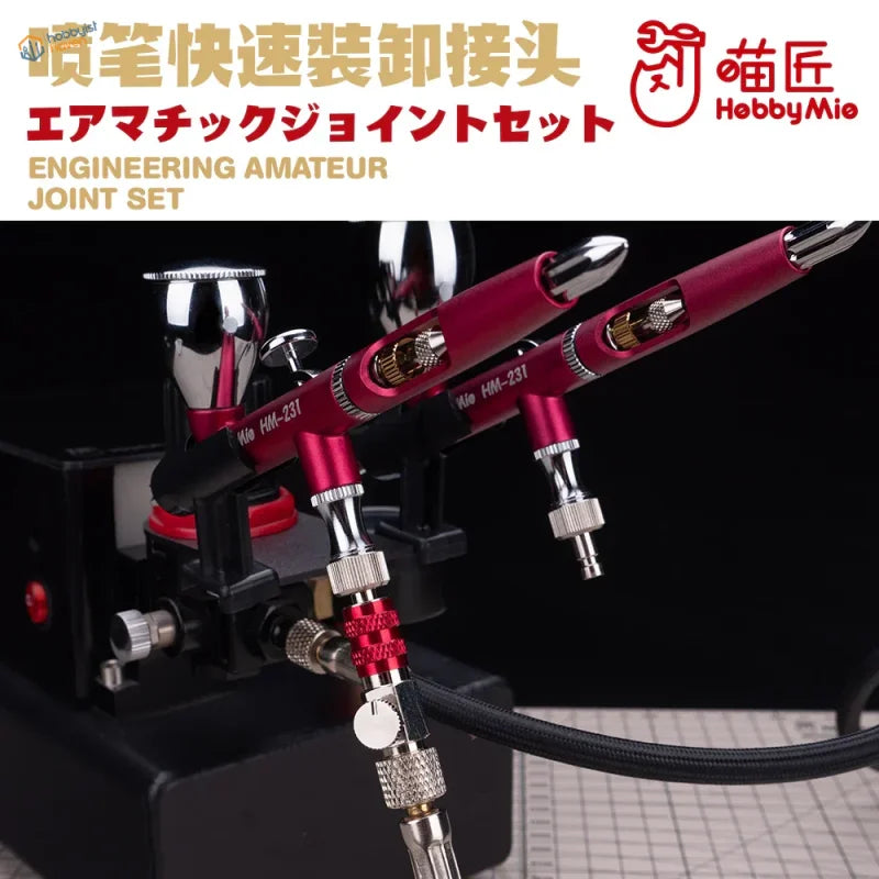 Red chrome airbrushes with MAC valve quick disconnect adapter on black stand