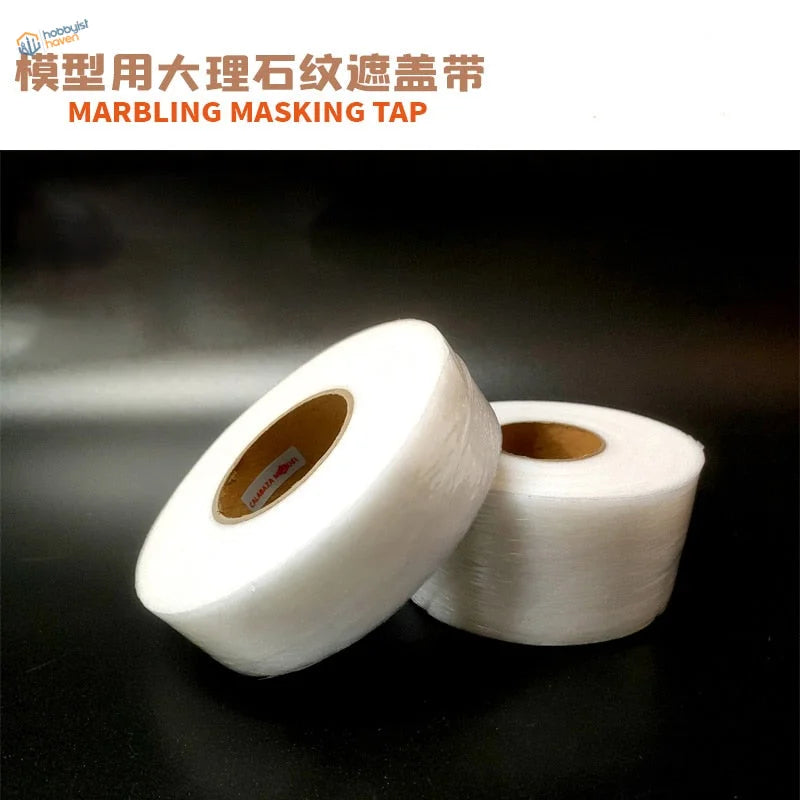 Two rolls of white translucent marbling masking tape with glossy finish
