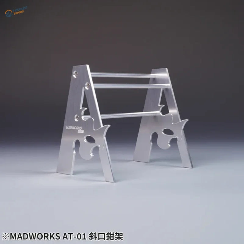 Silver Madworks metal holder for pliers with flame cutouts