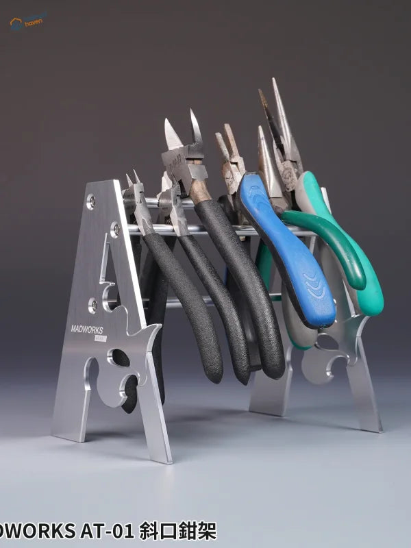 Silver metal holder for pliers with insulated handles for scale modeling tools