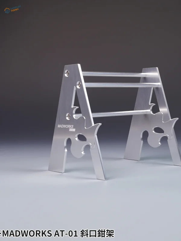 Silver metallic A-frame metal holder for pliers with angular cutouts for scale modeling tools