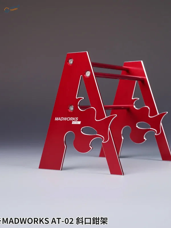 Red metallic A-frame metal holder for pliers with flame cutouts and Madworks branding