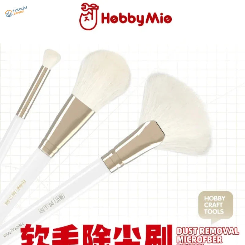 Microfiber dust removal brushes with white handles and gold ferrules