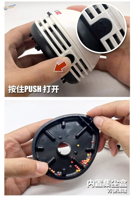 Mini desktop vacuum cleaner with white black circular design and dust tray
