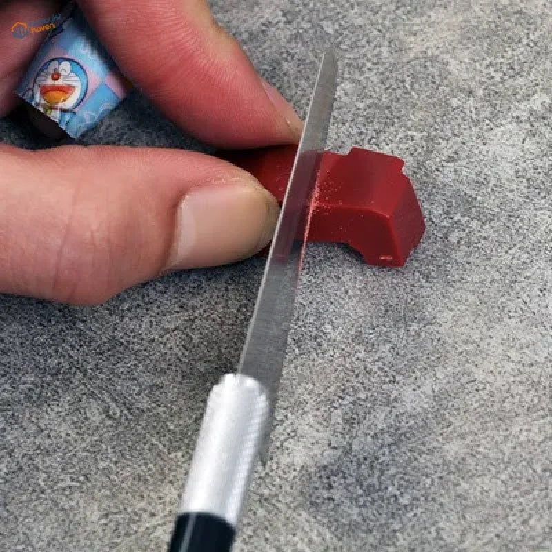 Red plastic toy car cut by mini modeling backsaws