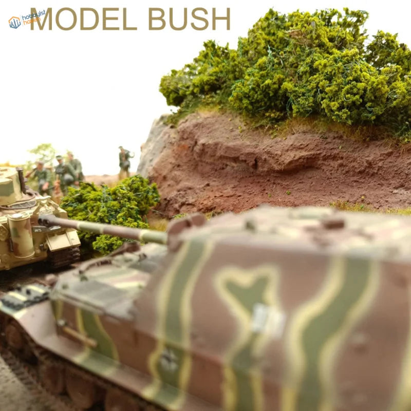 Camouflage-painted tank with miniature bushes for scale modeling dioramas
