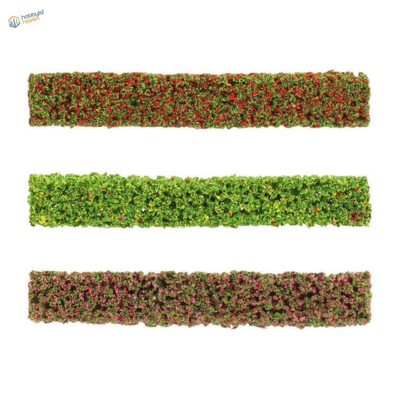 Three rectangular miniature flower clusters with green foliage and red pink accents