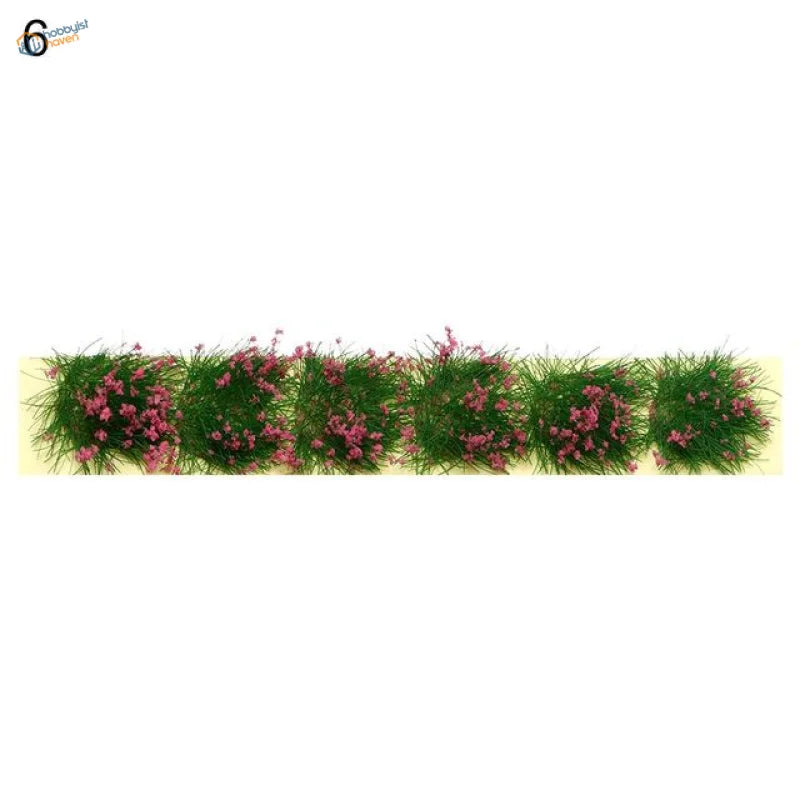 Miniature flower clusters: green grass tufts with pink flowers for dioramas