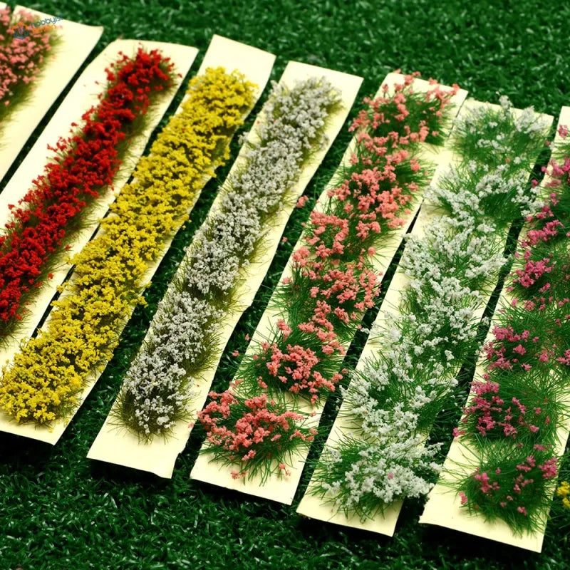 Colorful miniature flower clusters in red, yellow, pink, white, green on beige paper