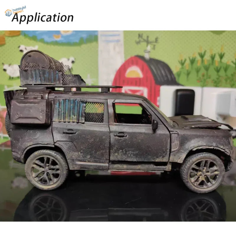 Miniature metal mesh dusty black model SUV with off-road features