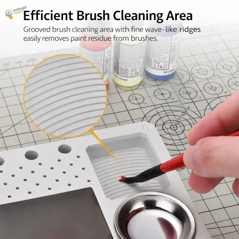 White plastic wet palette tray with grooved wave-like ridges and metal bowl for dispersing paper by Mo Shi Tools