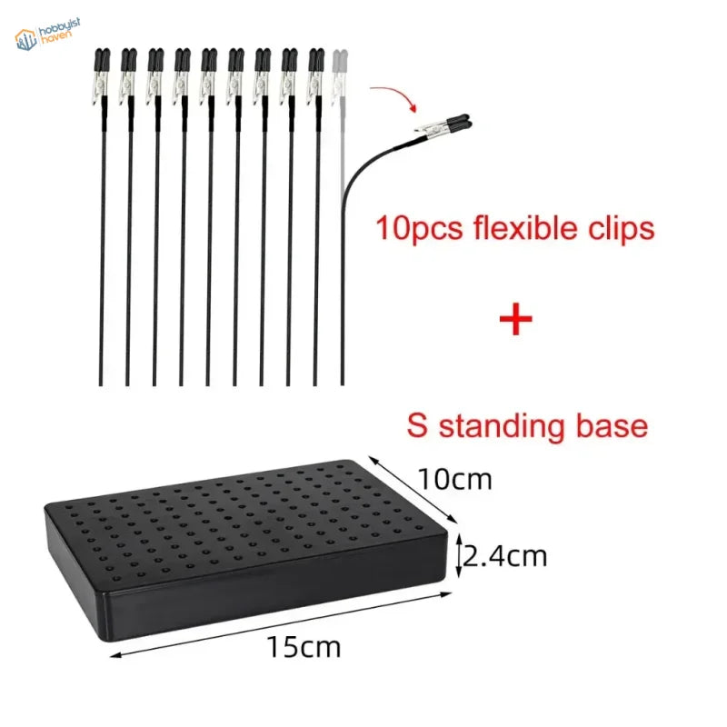Black standing base with grid of holes for magnetic alligator clips in model painting clip and stand system
