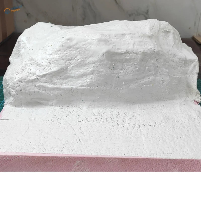 White textured resin mountain making plaster cloth rock sculpture