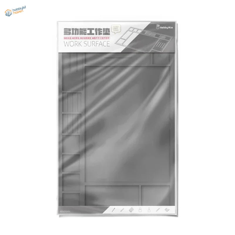 Gray translucent durable silicone work pad with molded compartments and grid lines