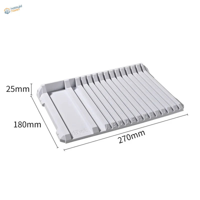 Gray multifunctional sprue holder with labeled slots for tools