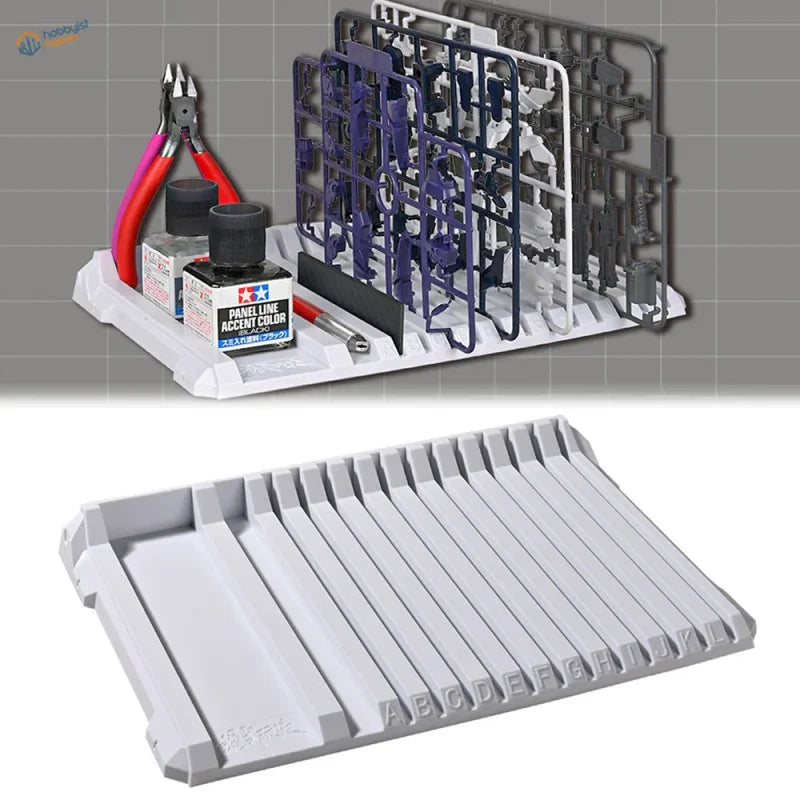Gray plastic multifunctional sprue holder tray with labeled parts slots