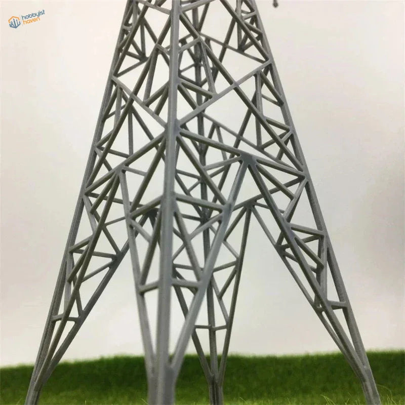 Gray metallic lattice transmission tower model in Multiple Scales Transmission Towers