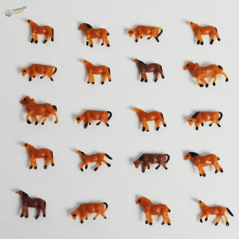 N scale 1:150 model painted miniature horses in orange and brown with black hooves