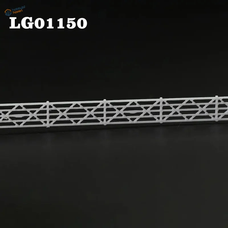 N scale white plastic building fence wall with geometric lattice-top picket design for station platform use