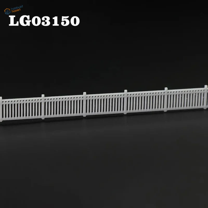 N scale white plastic model fence wall with vertical slats and posts for station platform or lattice-top picket use