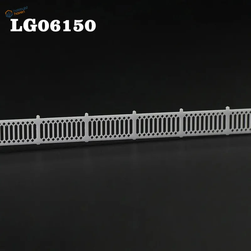 N scale white plastic model fence with lattice-top picket diamond and vertical bar pattern for station platform