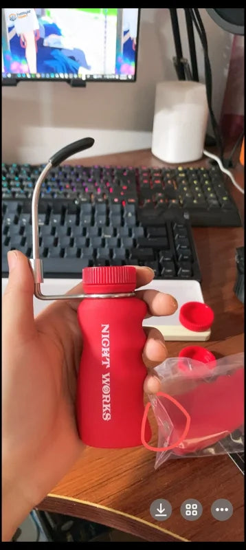 NightWorks painting handle: red silicone bottle with black handle, red cap