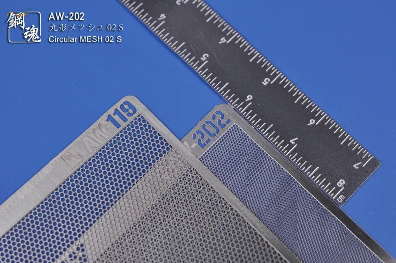 Silver circular photo-etch vent mesh metal sheets with fine perforations and engraved model numbers for precision hobby tools
