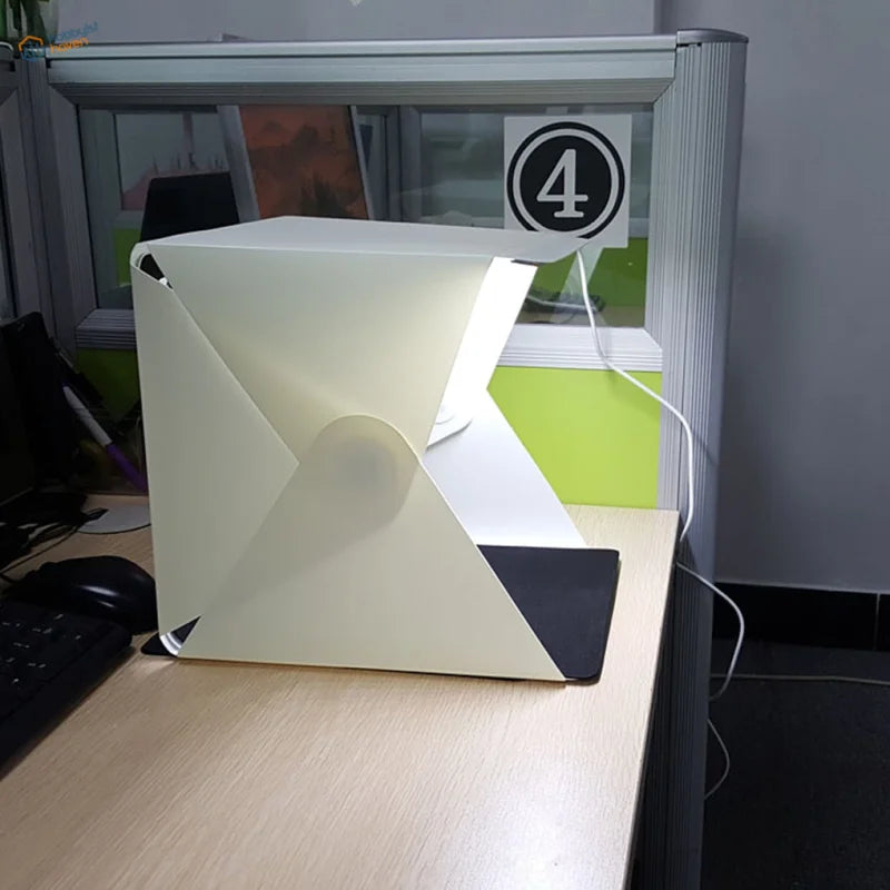 Portable LED lightbox in off-white with foldable design and black accents