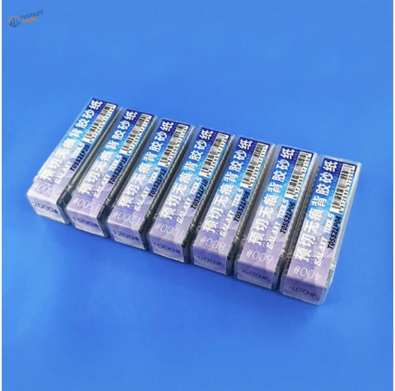 Seven grit packs of pre-cut adhesive sandpaper for the polishing tool