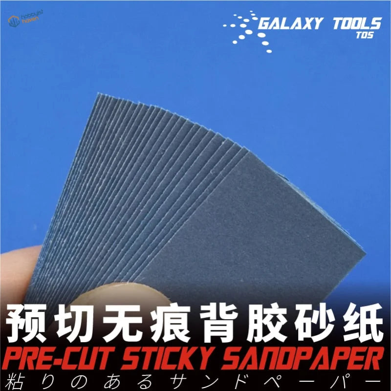 Hand holding pre-cut adhesive sandpaper sheets for the polishing tool