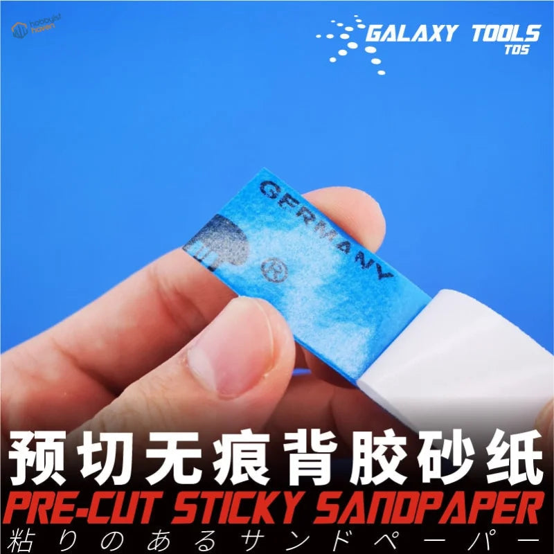 Pre-cut adhesive sandpaper for the polishing tool, held in fingers