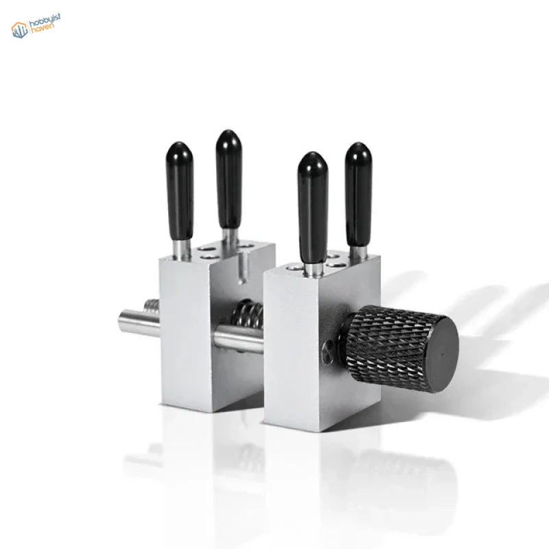 Precision micro vise with silver metal jaws, black textured handles, knurled knob