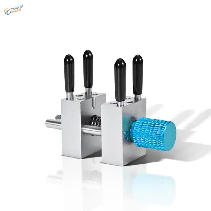 Precision micro vise with silver tool, black handles, blue knob