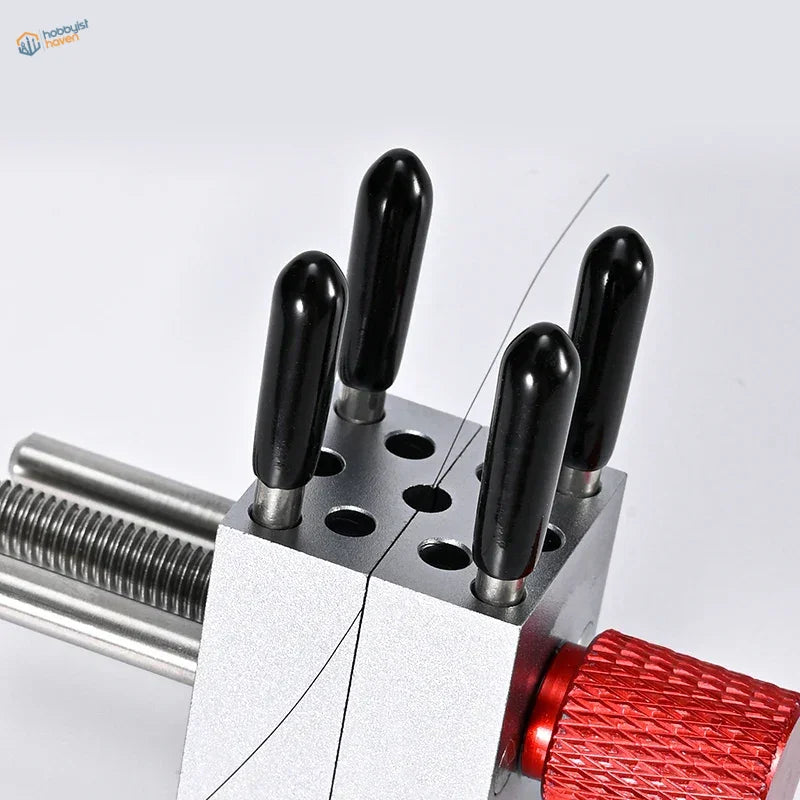 Precision micro vise with silver wire bending tool, black ergonomic handles, red knob
