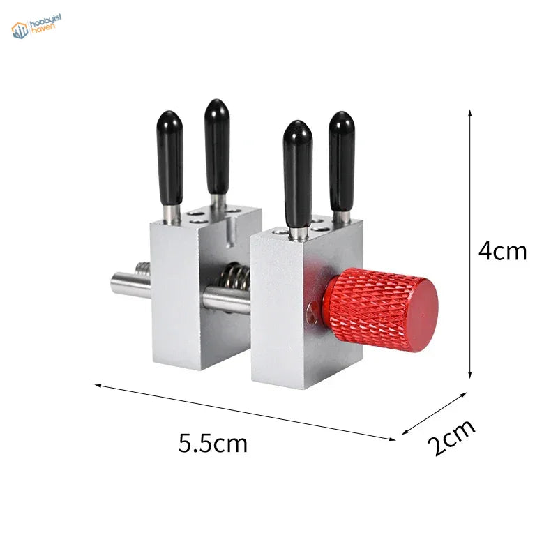 Precision micro vise with silver tool, black handles, red knob