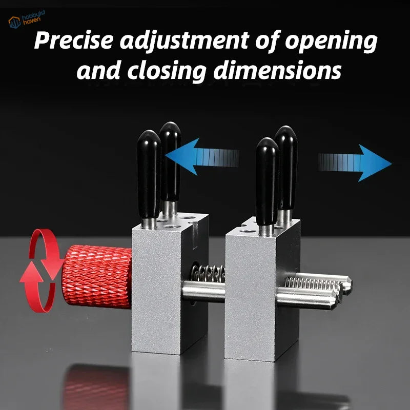 Precision micro vise with silver clamps, black handles, red knob