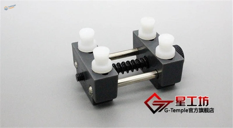 Precision mini vise black plastic watch winding tool with white knobs