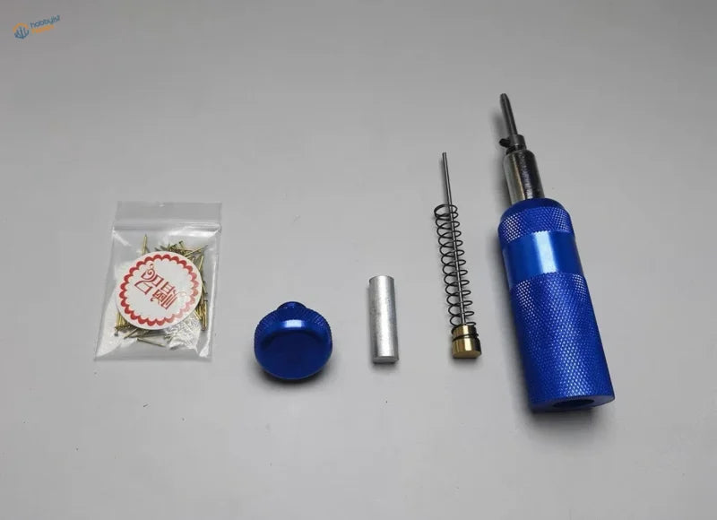 Professional nail presser tool with blue textured grip and spring mechanism