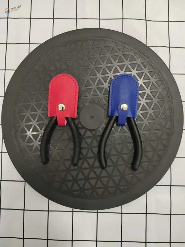 Red and blue pliers in protective holster for scale modeling tools