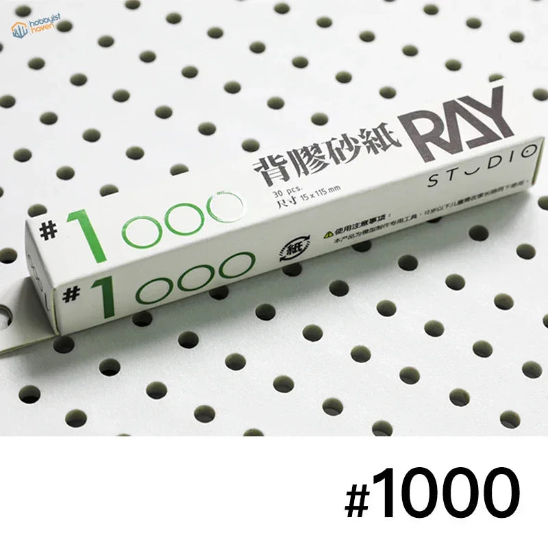 Ray Studio #1000 self-adhesive sandpaper box with green black text