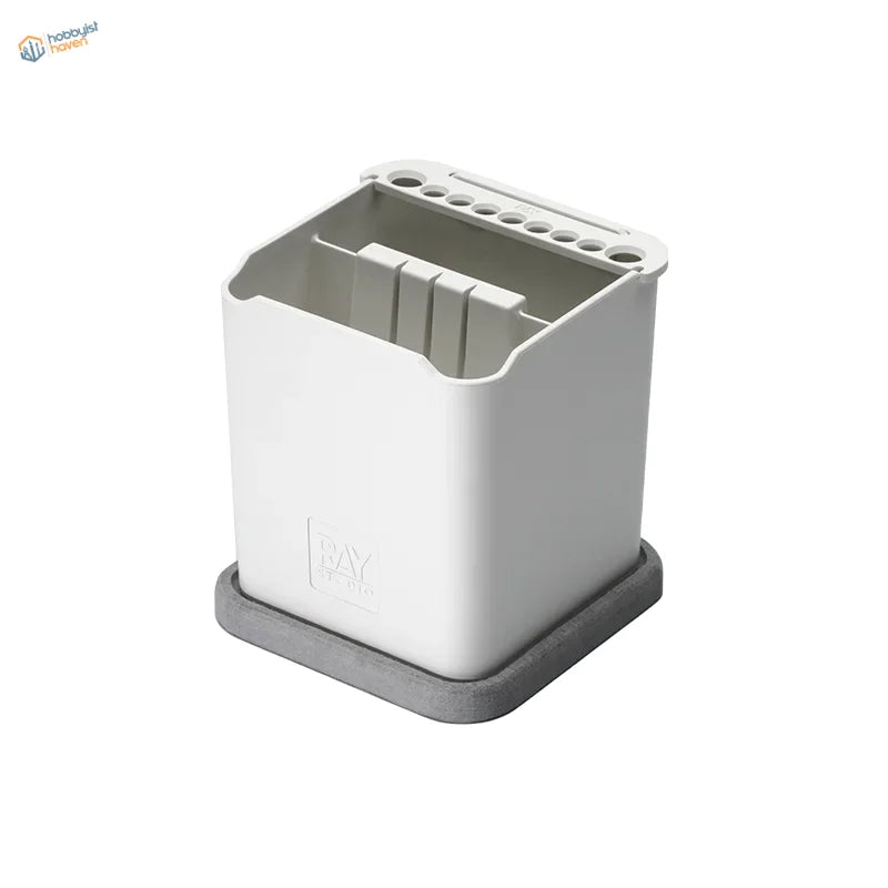Ray studio two-in-one brush-cleaning pot with white plastic utensil holder and gray silicone base for organizing tools