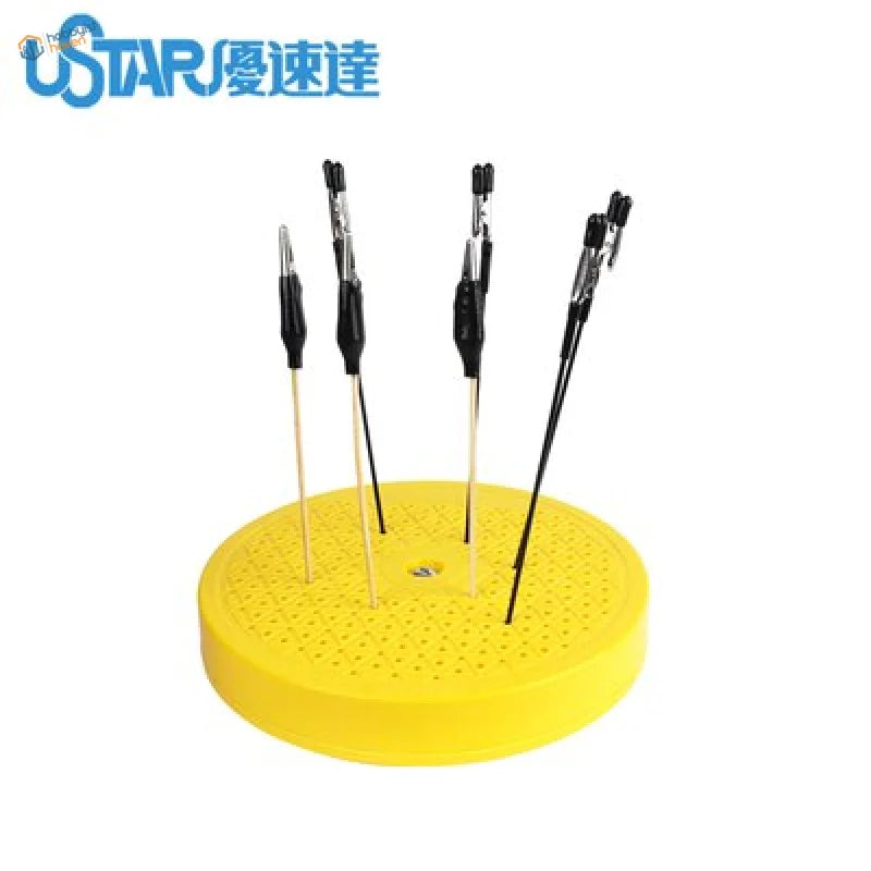 Yellow handled screwdrivers on rotary painting turntable for Gundam modeling