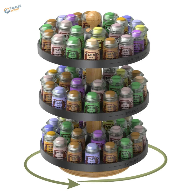 Three-tiered rotating paint bottle organizer holding assorted citadel base aradoo paint pots in various colors